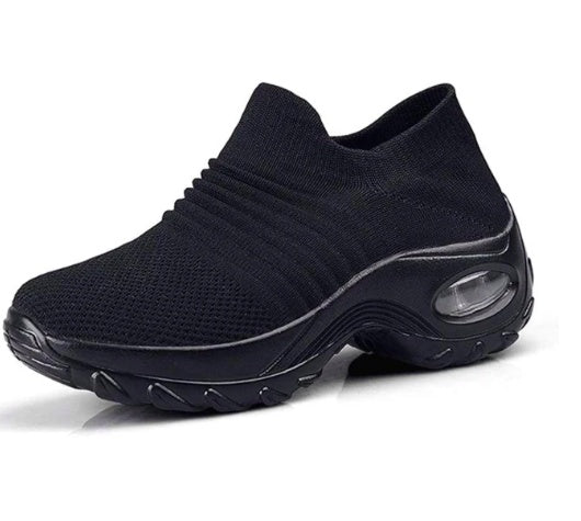 Black knit slip-on sneaker with air cushion visible in sole.