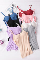 Eight colorful camisole tank tops with spaghetti straps.