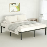 A black metal bed frame with white bedding and a gray throw blanket in a bedroom.