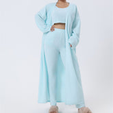 Light blue fuzzy 3-piece lounge set with robe and crop top.