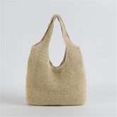 Tan woven raffia hobo bag with a soft lining.