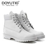 All-white waterproof work boots with silver eyelets.