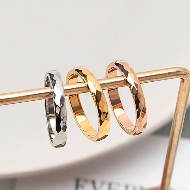 Silver, gold, and rose gold hammered/faceted rings.