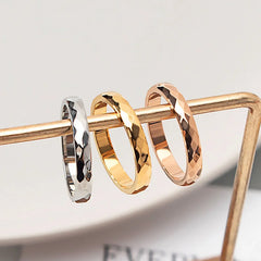 Silver, gold, and rose gold hammered/faceted rings.