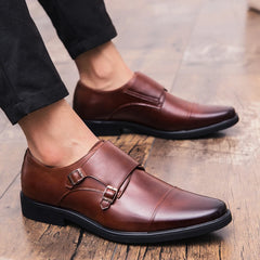 Pair of men's brown leather double monk strap shoes.