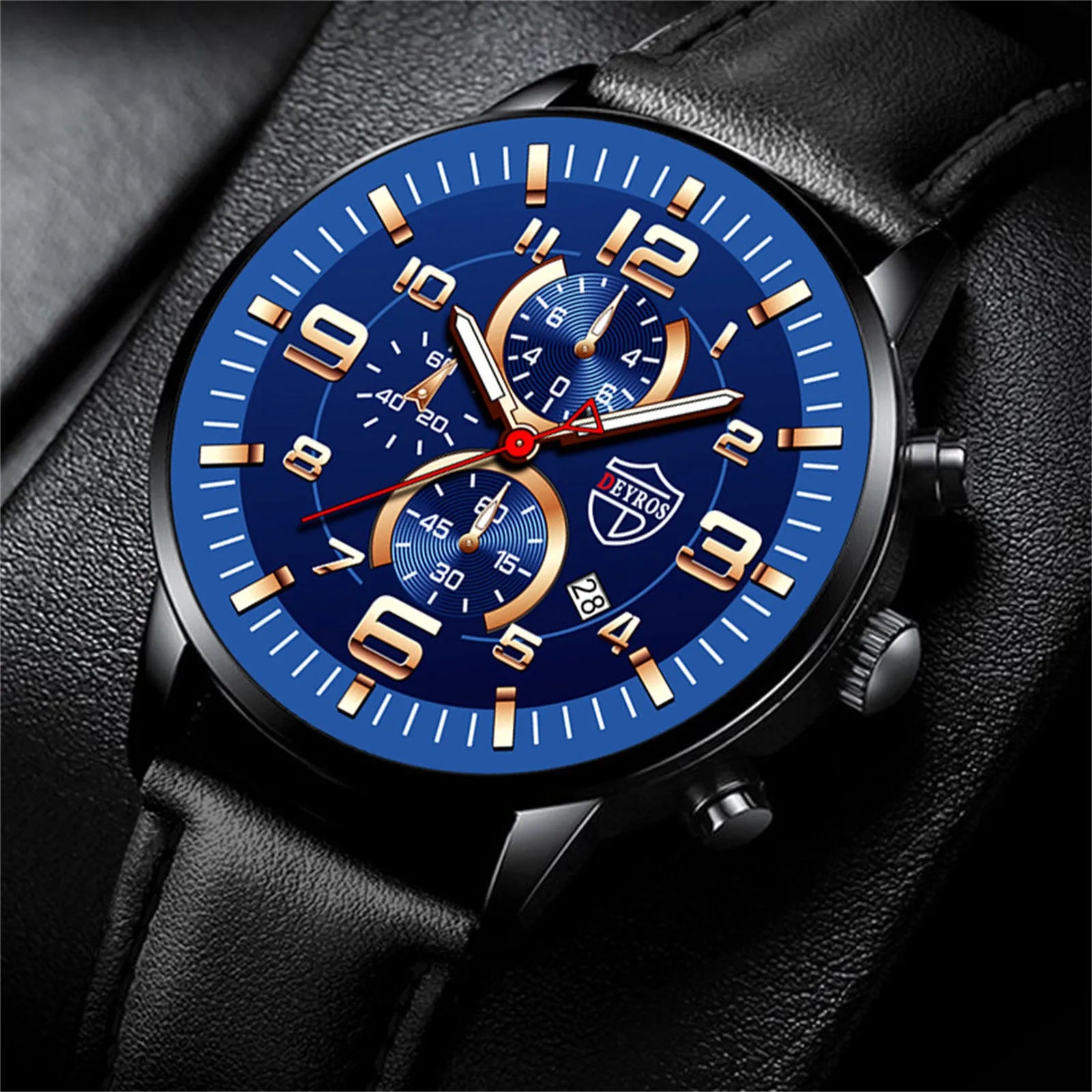 A men's chronograph watch with a blue face, gold accents, and a black leather strap.