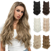 Woman with long wavy hair and five halo hair extensions in different colors.