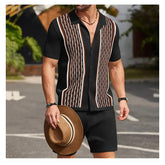 Man in black knit polo shirt with brown/white vertical stripes and shorts.
