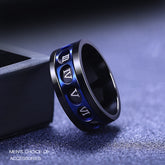 Black and blue spinner ring with Roman numerals.