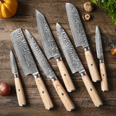 Seven-piece Damascus-style stainless steel kitchen knife set.