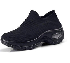 Black knit slip-on sneaker with air cushion visible in sole.