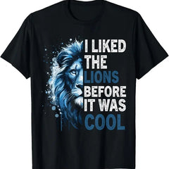A black T-shirt with a blue lion face and the text "I Liked The Lions Before It Was Cool".