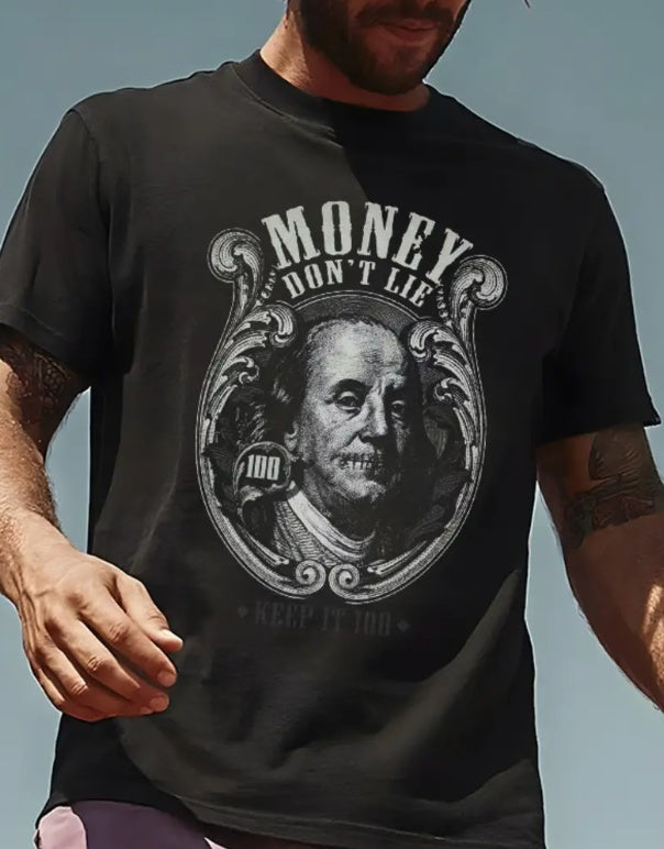 A man in a black T-shirt with a Ben Franklin money print that says "Money Don't Lie".