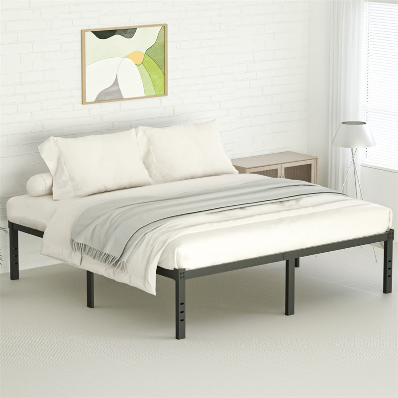 A black metal bed frame with white bedding and a gray throw blanket in a bedroom.