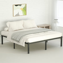 A black metal bed frame with white bedding and a gray throw blanket in a bedroom.