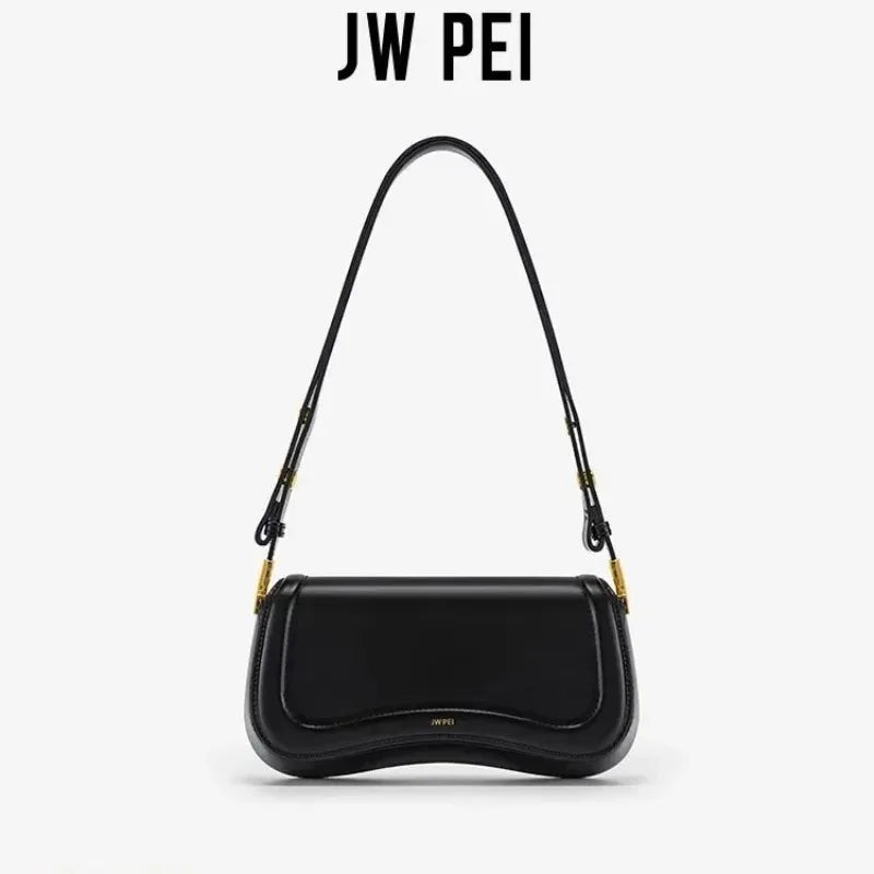 Jarreims Emporium: Black shoulder bag with curved wavy bottom.