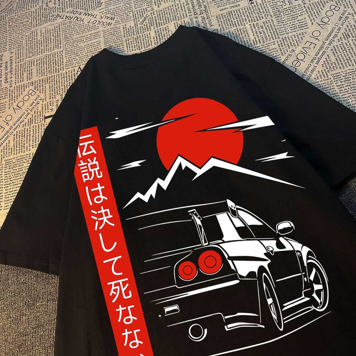 Black t-shirt with sports car, red sun, and Japanese text.