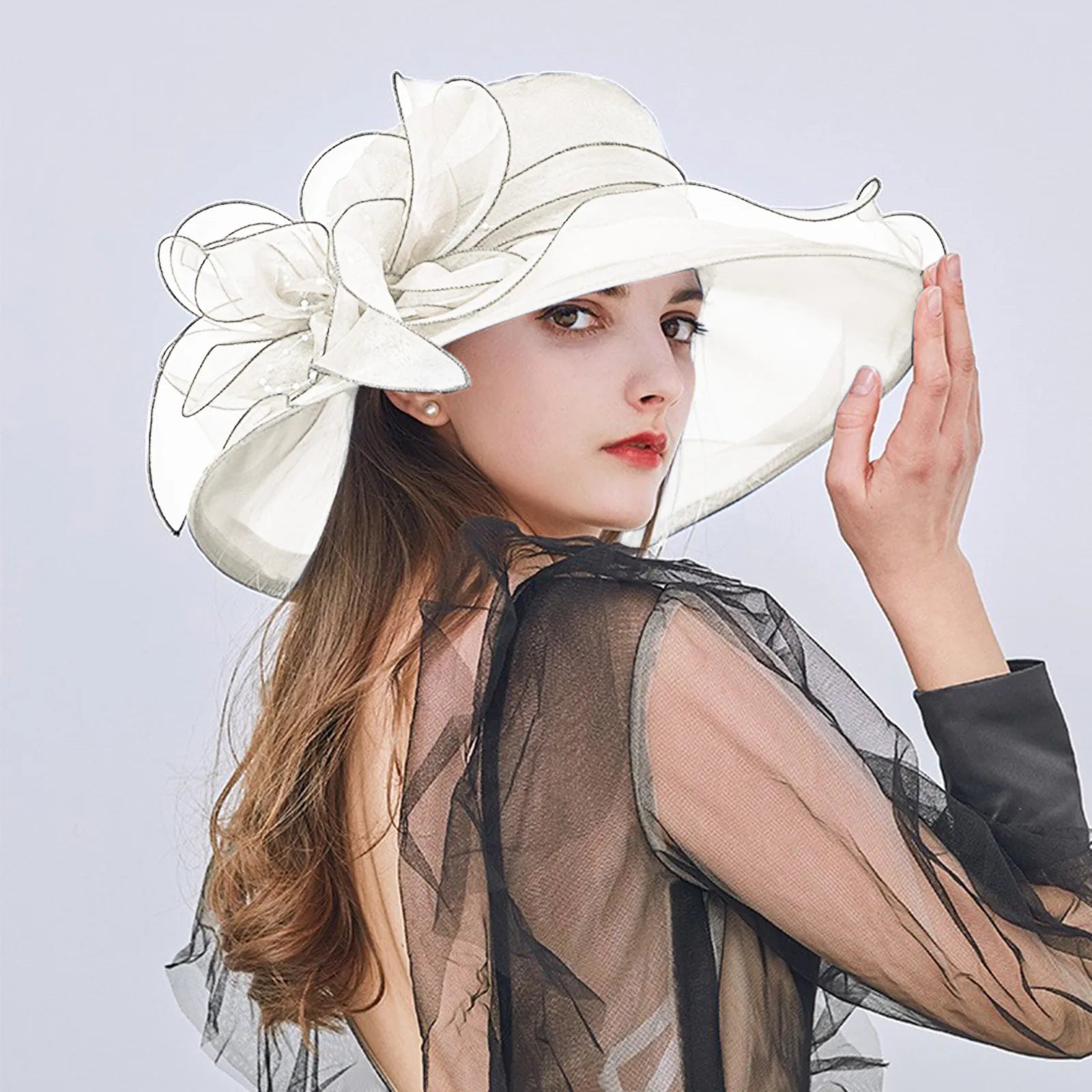 Jarreims Emporium: Woman in white floppy hat with sheer flower.