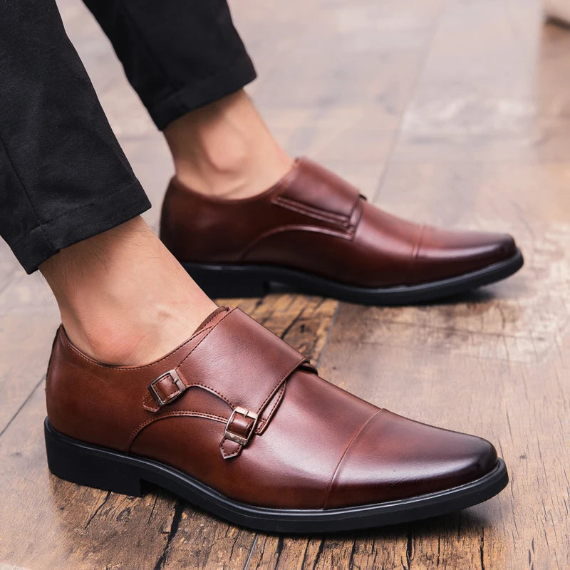 Pair of men's brown leather double monk strap shoes.