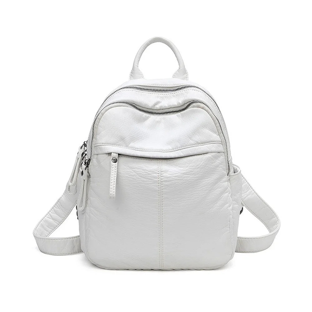 Front view of a small white faux leather backpack.
