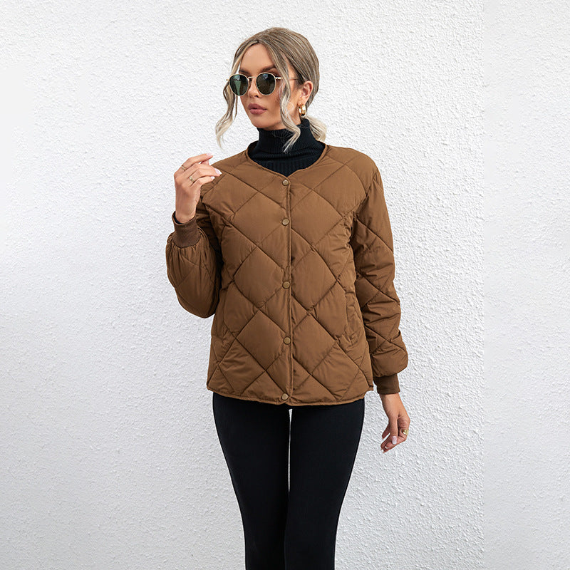 Woman in brown diamond-quilted snap-button jacket.