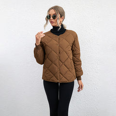 Woman in brown diamond-quilted snap-button jacket.