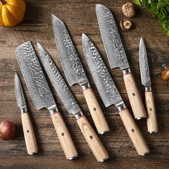 Seven-piece Damascus-style stainless steel kitchen knife set.